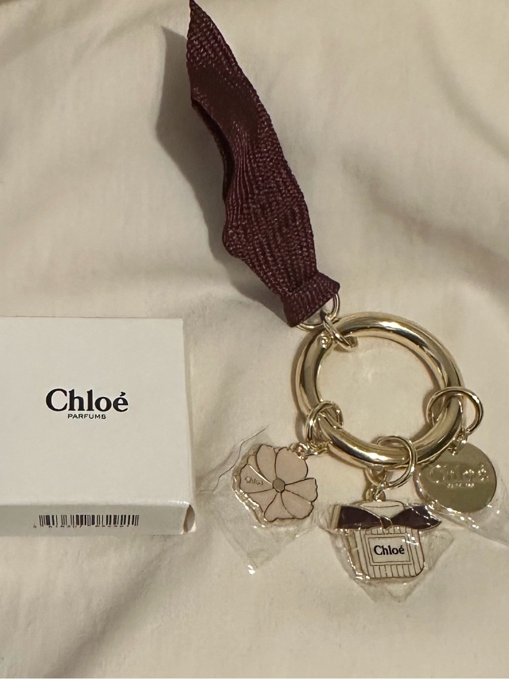 Chloe Burgundy Ribbon Charm Keyring with Gold Hardware